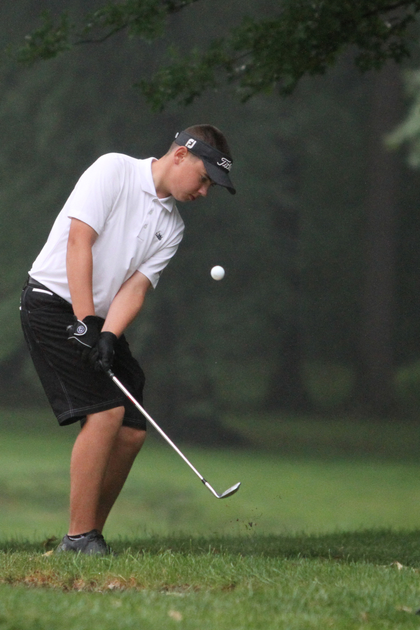 Nikos Frazier | The Vindicator..Cole Christman, of Canfield, chips the ball onto the green.