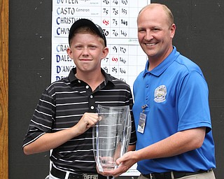 Nikos Frazier | The Vindicator..Maxwell Moldovan, of Uniontown, Ohio, shakes Brian Tolner, Mill Creek MetroParks Director of Golf after placing third in the Mill Creek Foundation Junior All-Star.