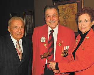 SPECIAL TO THE VINDICATOR
Austintown Lions and Lioness Clubs recently met for installation of officers. Paul Metrovich, center, presented the gavel to John Susany, left, Lions president, and Lori Stone, Lionesses president.