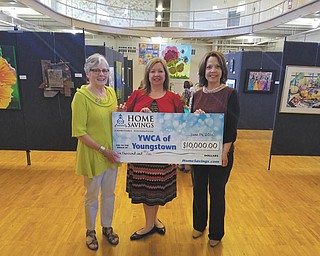 SPECIAL TO THE VINDICATOR
Home Savings Charitable Foundation recently donated $10,000 as a corporate sponsor for YWCA Women Artists: A Celebration! Receiving the check, from left, are Barbara Faires, YWCA Women Artists committee cochairman and Leah Merritt, YWCA president and chief executive officer, and presenting the check is Trish Mohan, branch manager of Home Savings main office. All proceeds will benefit the Barbara Wick Transitional Housing Program for women. For information about the YWCA call 330-746-6361 or visit ywca.org/youngstown.