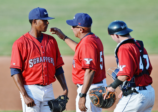 Jeff Lange | The Vindicator  SAT, JUN 25, 2016 - Scrappers' starting pitcher Luis Jimenez (left) has a meeting at the mound with manager Edwin Rodriguez and catcher Logan Lee early in Saturday's game against Batavia.