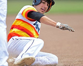 STRUTHERS, OHIO - JUNE 26, 2016: Matt Gibson #24 of Astro slides into third base to complete a three RBI triple in the second inning of Sunday afternoons Bob Cene Tournament Championship game. Astro won 11-1. DAVID DERMER | THE VINDICATOR