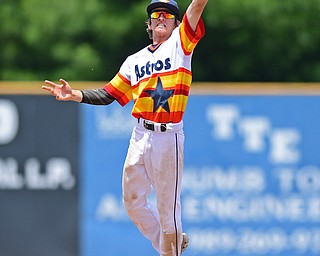 STRUTHERS, OHIO - JUNE 26, 2016: Short stop Branden Myers #12 of Astro leaps to play the ball on the hop before throwing to first for the out in the fourth inning of Sunday afternoons Bob Cene Tournament Championship game. Astro won 11-1. DAVID DERMER | THE VINDICATOR