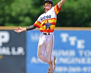 STRUTHERS, OHIO - JUNE 26, 2016: Short stop Branden Myers #12 of Astro leaps to play the ball on the hop before throwing to first for the out in the fourth inning of Sunday afternoons Bob Cene Tournament Championship game. Astro won 11-1. DAVID DERMER | THE VINDICATOR