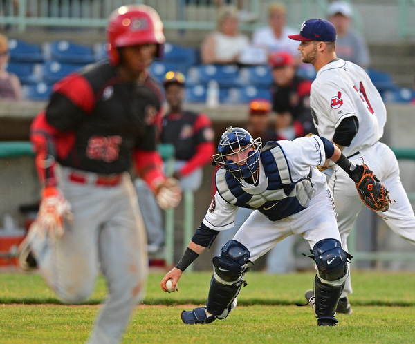 NILES, OHIO - JUNE 27, 2016: Catcher Logan Ice #47 of the Scrappers field the baseball before throwing to first to force out Samuel Castro #25 of the Muckdogs in the sixth inning of Monday nights game at Eastwood Field. DAVID DERMER | THE VINDICATOR