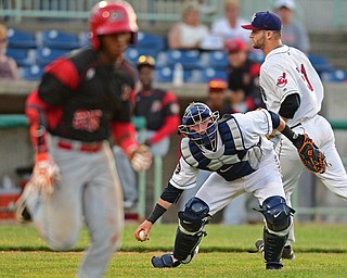 NILES, OHIO - JUNE 27, 2016: Catcher Logan Ice #47 of the Scrappers field the baseball before throwing to first to force out Samuel Castro #25 of the Muckdogs in the sixth inning of Monday nights game at Eastwood Field. DAVID DERMER | THE VINDICATOR