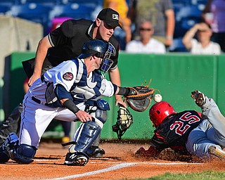 NILES, OHIO - JUNE 27, 2016: Catcher Logan Ice #47 of the Scrappers loses control of the baseball after applying a tag to Samuel Castro #25 of the Muckdogs, allowing the run to score in the first inning of Monday nights game at Eastwood Field. DAVID DERMER | THE VINDICATOR