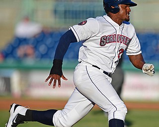 NILES, OHIO - JUNE 27, 2016: Base runner Emmanuel Tapia(28) of the Scrappers rounds third base to head home and score on a single by Grofi Cruz in the second inning of Monday nights game at Eastwood Field. DAVID DERMER | THE VINDICATOR