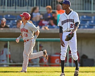 NILES, OHIO - JUNE 28, 2016: Starting pitcher Triston McKenzie(23) of the Scrappers shows his frustration while Tres Berrera(15) of the Doubledays trots the bases after a solo home run in the second inning of Tuesday nights game at Eastwood Field. DAVID DERMER | THE VINDICATOR