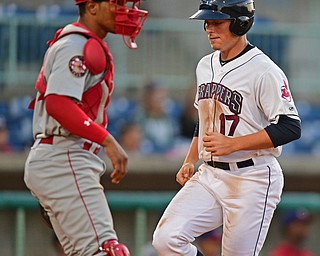 NILES, OHIO - JUNE 28, 2016: Base runner Nate Winfrey(17) of the Scrappers score a run on a RBI single by Jodd Carter in the sixth inning of Tuesday nights game at Eastwood Field. DAVID DERMER | THE VINDICATOR