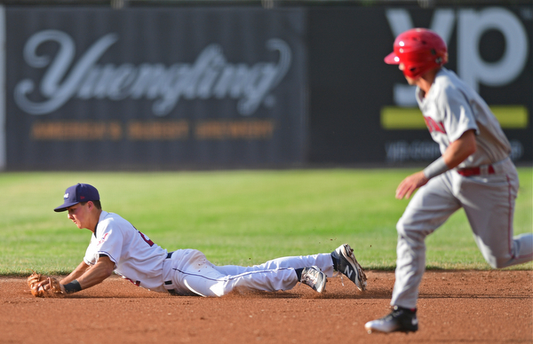 Short stop Luke Wakamatsu(22) of the Scrappers picks himself up off the ground after diving to prevent a extra base hit in the second inning of Wednesday nights game at Eastwood Field. DAVID DERMER | THE VINDICATOR