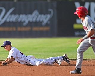 Short stop Luke Wakamatsu(22) of the Scrappers picks himself up off the ground after diving to prevent a extra base hit in the second inning of Wednesday nights game at Eastwood Field. DAVID DERMER | THE VINDICATOR