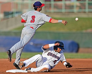Clayton Brandt(3) of the Doubledays throws the ball to first to turn a double play after forcing out Gian Paul Gonzalez(16) of the Scrappers in the third inning of Wednesday nights game at Eastwood Field. DAVID DERMER | THE VINDICATOR