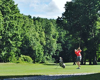 Bryan Kordupel of Boardman watches his approach shot from the No. 3 fairway during Wednesday's 2016 Flynn Auto Group Junior Greatest Golfer of the Valley tournament Wednesday at Mill Creek South Course. Kordupel placed U-17...--Jeff Lange | The Vindicator  WED, JUN 29, 2016