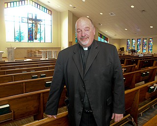 William D. Lewis/The Vindicator Rev. Frank Zanni, pastor St. Thomas The Apostle stands in sanctuary of new church.