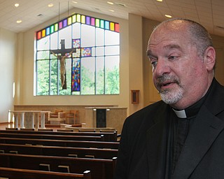 William D. Lewis/The Vindicator Rev. Frank Zanni, pastor St. Thomas The Apostle stands in sanctuary of new church.