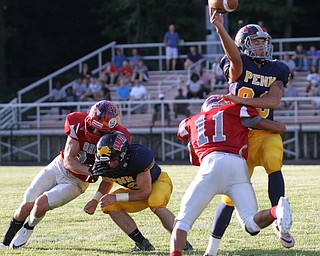 Nikos Frazier | The Vindicator..Brandon Mitchell(11) tackles Dylan Kleckner(89) in the first quarter of the 2016 Battle of the Border at Springfield High School in New Middleton.