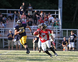 Nikos Frazier | The Vindicator..Zack Hicks(34) looks for a lane in the first quarter of the 2016 Battle of the Border at Springfield High School in New Middleton.