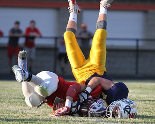 Nikos Frazier | The Vindicator..Ohio's Jacob Ward(1) and Pennsyvania's Matt Dunning(7) tumble after colliding in the first half of the 2016 Battle of the Border at Springfield High School in New Middleton.