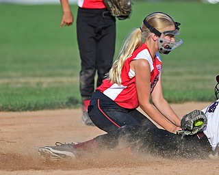 BOARDMAN, OHIO - JUNE 30, 2016: Carlie Harmon(9_ of Canfield (left) tags out runner Gina Truiueri(11) of Boardman (right) as she tries to steal second in the fifth inning of their District 2 softball championship game at the Field of Dreams. DAVID DERMER | THE VINDICATOR