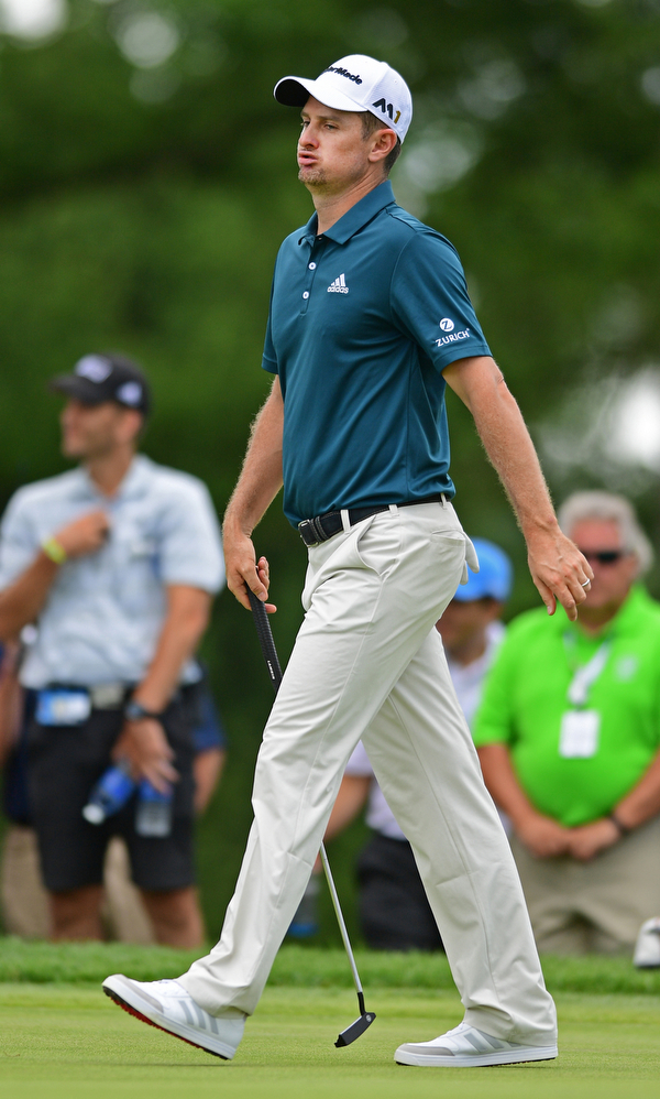 AKRON, OHIO - JULY 1, 2016: Justin Rose exhales in frustration after his putt came up short on the 12th hole, Friday afternoon during the second round of the Bridgestone Invitational at Firestone Country Club. DAVID DERMER | THE VINDICATOR