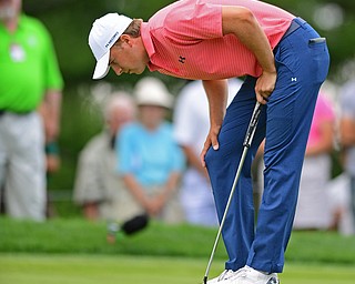 AKRON, OHIO - JULY 1, 2016: Jordan Spieth stares at his golf ball after it failed to drop into the hole on the 12th hole, Friday afternoon during the second round of the Bridgestone Invitational at Firestone Country Club. DAVID DERMER | THE VINDICATOR