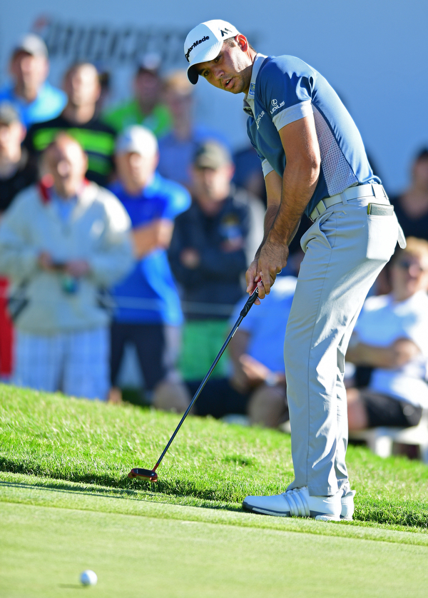 AKRON, OHIO - JULY 1, 2016: Jason Day putts on the 18th hole, Friday afternoon during the second round of the Bridgestone Invitational at Firestone Country Club. DAVID DERMER | THE VINDICATOR