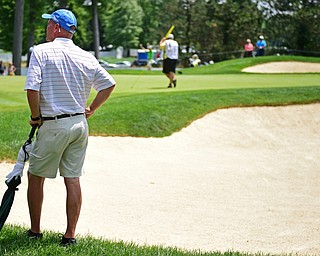 AKRON, OHIO - JULY 1, 2016: Jeff Overly of Boardman, watches the action on the 14th green at Firestone Country Club, Friday afternoon. Overly represented Stryker as a Honorary Observer, after having a total knee replacement in December of 2014. DAVID DERMER | THE VINDICATOR