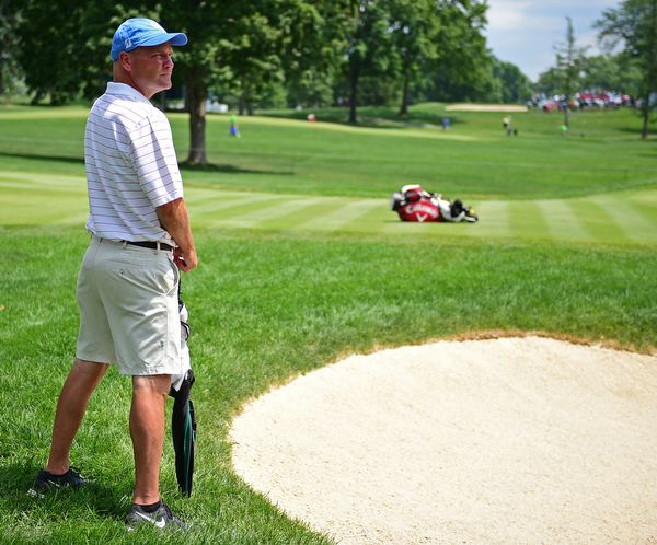 AKRON, OHIO - JULY 1, 2016: Jeff Overly of Boardman, watches the action on the 14th green at Firestone Country Club, Friday afternoon. Overly represented Stryker as a Honorary Observer, after having a total knee replacement in December of 2014. DAVID DERMER | THE VINDICATOR