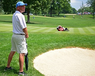AKRON, OHIO - JULY 1, 2016: Jeff Overly of Boardman, watches the action on the 14th green at Firestone Country Club, Friday afternoon. Overly represented Stryker as a Honorary Observer, after having a total knee replacement in December of 2014. DAVID DERMER | THE VINDICATOR