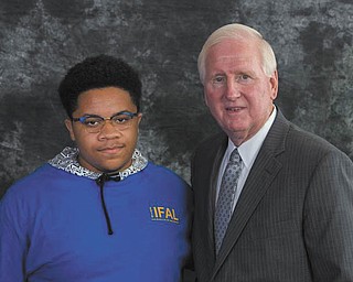 SPECIAL TO THE VINDICATOR
Mahoning County student Joshua Batchelor of Austintown, left, receives a certificate of completion for participating in the Farm Bureau Institute for Future Agricultural Leaders by North Carolina Farm Bureau President Larry Wooten. The program assists exceptional rising high school seniors across the state in exploring a wide variety of agricultural-related college majors available at North Carolina A&T State University and North Carolina State University.
