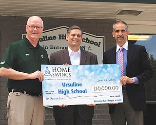SPECIAL TO THE VINDICATOR
Ursuline High School recently received a check of $10,000 from the Home Savings Charitable Foundation for the high school science wing renovation project. Receiving the check, from left, is the Rev. Richard Murphy, president of the high school; Matt Sammartino, principal of the high school; and presenting the check is Lou Joseph, vice president of real estate and facilities at Home Savings. The science wing was constructed in 1955. The renovation, which began last summer, will include state of the art technology to bring the workspace into the 21st century. Construction this summer will transform the remaining three labs into two larger modern life science labs. For information about the high school, call 330-744-4563.
