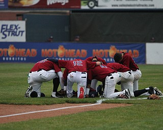 Nikos Frazier | The Vindicator..Scrappers kneel in silence before taking on the Vermont Lake Monsters on July 4, 2016.