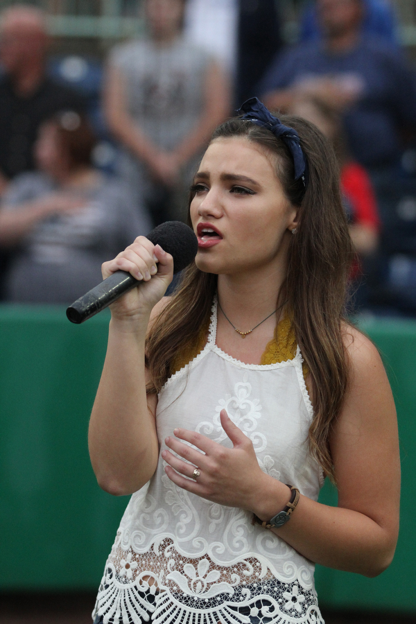 Nikos Frazier | The Vindicator..Abigail Roberts of Howland sings the national anthem at the July 4, 2016 Scrappers game at Eastwood Field.