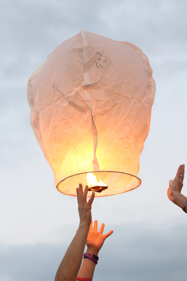 Nikos Frazier | The Vindicator..A Chinese lantern with messages for Kristy Wolfe Taafe is released at a candlelight vigil at Struthers Elementary School. Taafe died unexpectedly on Sunday.