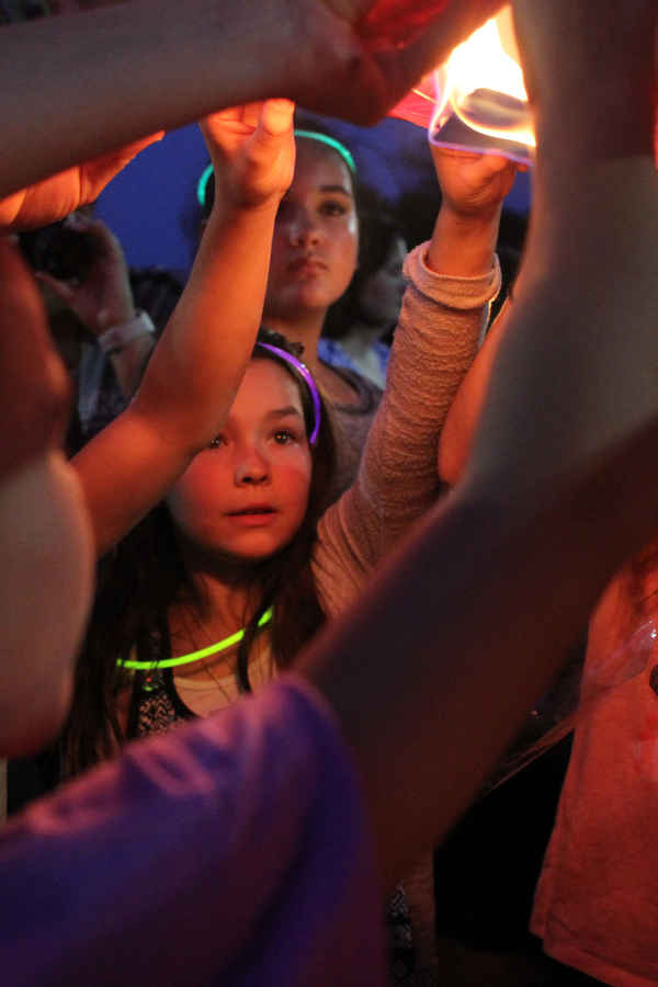 Nikos Frazier | The Vindicator..Gianna Taafe, 9, holds part of a Chinese lantern with messages from her classmates to her late mother, Kristy Wolfe Taafe, who died unexpectedly Sunday.