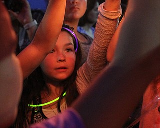 Nikos Frazier | The Vindicator..Gianna Taafe, 9, holds part of a Chinese lantern with messages from her classmates to her late mother, Kristy Wolfe Taafe, who died unexpectedly Sunday.