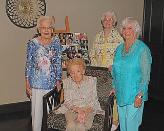 Peg McGoogan of Poland (seated) poses for a picture with her sisters (standing left to right) Gin Bompiani (95) of Mt Pleasant, Pa , Sis Grosser (98) of Mt Pleasent, Pa. , and Nore' Doubles (90) of Bowling Green, Ky. during McGoogans 100th birthday party at The Lake Club in Poland on Sunday afternoon.  Dustin Livesay  |  The Vindicator  6/26/16  The Lake Club, Poland.