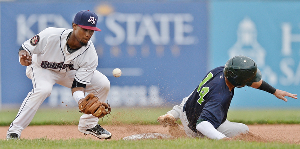 Jeff Lange | The Vindicator  WED, JUL 6, 2016 - Scrappers second baseman Erlin Cerda (left) misses the throw from home plate as Lakemonsters' base runner Steven Pallares (14) slides safely into the bag in the second inning of Wednesday's game at Eastwood Field.