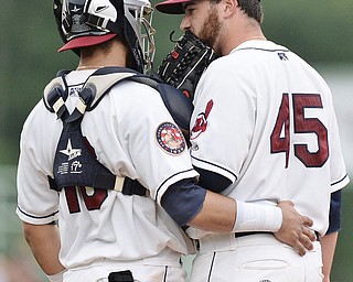 Jeff Lange | The Vindicator  WED, JUL 6, 2016 - Mahoning Valley starting pitcher Aaron Civale (45) has a meeting at the mound with catcher Gian Paul Gonzalez in the second inning of Wednesay's game against the Vermont Lakemonsters at Eastwood Field.