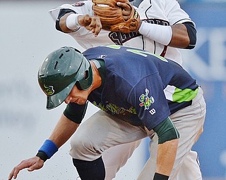 Jeff Lange | The Vindicator  WED, JUL 6, 2016 - Scrappers second baseman Erlin Cerda (top) turns a double play over Vermont base runner Eli White in the second inning of Wednesday's game at Eastwood Field.