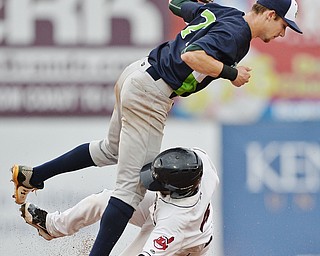 Jeff Lange | The Vindicator  WED, JUL 6, 2016 - Scrappers Erlin Cerda (bottom) collides with Lakemonsters' Eli White as he fails to steal second base in the bottom of the second inning of Wednesday's game at Eastwood Field.