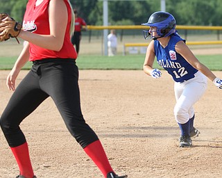Nikos Frazier | The Vindicator..Poland's Camryn Latttanzio(12) swings back to first base after an attempted steal at the Field of Dreams in Boardman.