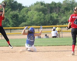 Nikos Frazier | The Vindicator..Poland's Camryn Latttanzio(12) slides into second in the Junior League district title game at the Field of Dreams in Boardman.