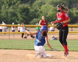 Nikos Frazier | The Vindicator.. Poland's Brooke Bobbey(1), slides into second base in the Junior League district title game at the Field of Dreams in Boardman.