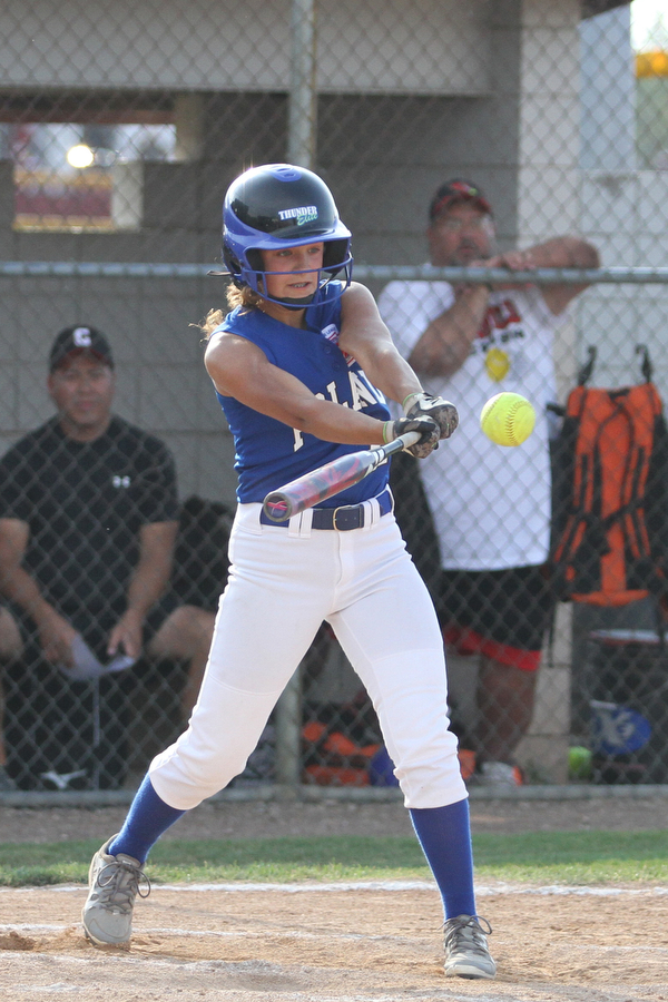 Nikos Frazier | The Vindicator..Poland's Hannah Dinard(24) swings in the Junior League district title game at the Field of Dreams in Boardman.