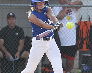 Nikos Frazier | The Vindicator..Poland's Hannah Dinard(24) swings in the Junior League district title game at the Field of Dreams in Boardman.