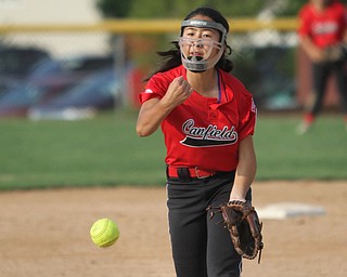 Nikos Frazier | The Vindicator..Canfield's, Kaili Gross(17), pitches in the Junior League district title game at the Field of Dreams in Boardman.