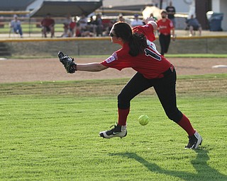 Nikos Frazier | The Vindicator..Canfield's Brianna Dunlap(18) misses a catch in right field in the Junior League district title game at the Field of Dreams in Boardman.