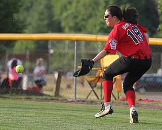 Nikos Frazier | The Vindicator..Canfield's Brianna Dunlap(18) attempts to catch a ball in the Junior League district title game at the Field of Dreams in Boardman.